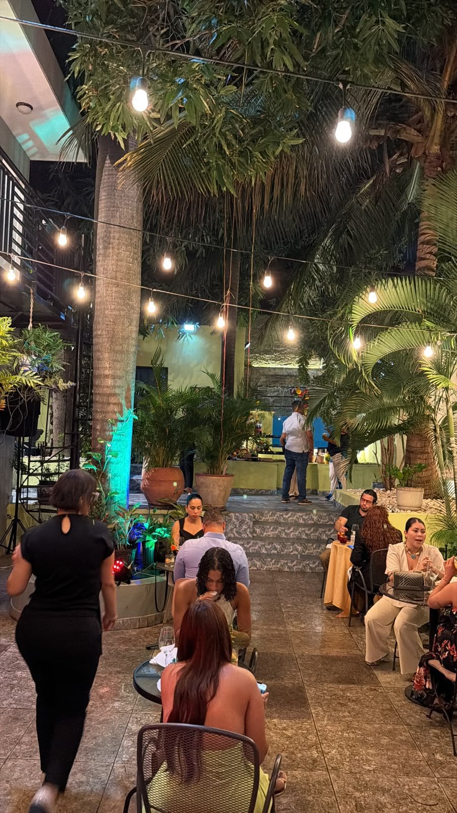 Guests enjoying a special event in the tropical courtyard